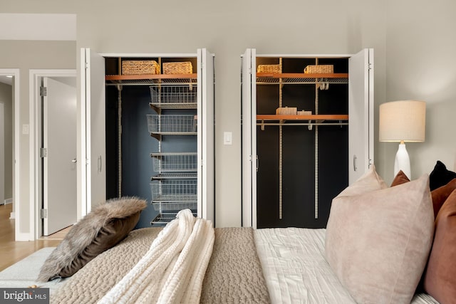 bedroom with hardwood / wood-style floors and a closet