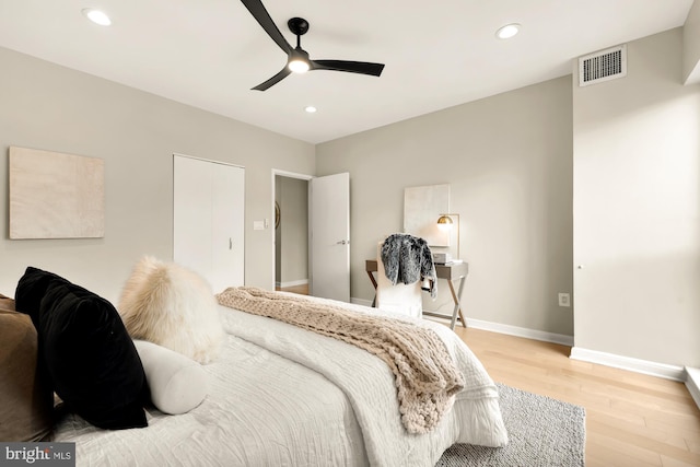 bedroom featuring ceiling fan and light hardwood / wood-style flooring