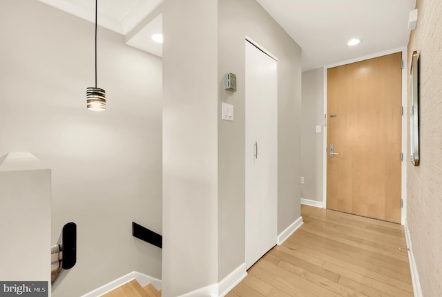 corridor with light hardwood / wood-style flooring