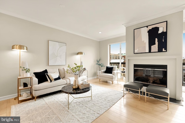 living room with hardwood / wood-style floors and crown molding