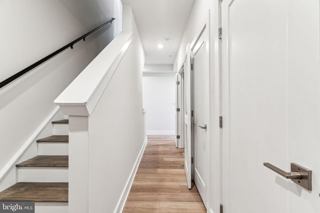 hallway with light hardwood / wood-style flooring