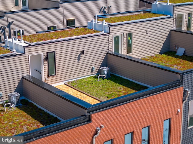 view of side of property featuring central AC unit