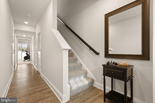 staircase featuring hardwood / wood-style floors