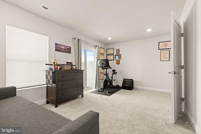 workout area with light colored carpet