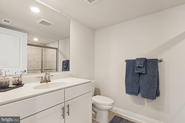 bathroom featuring vanity, toilet, tile patterned floors, and an enclosed shower