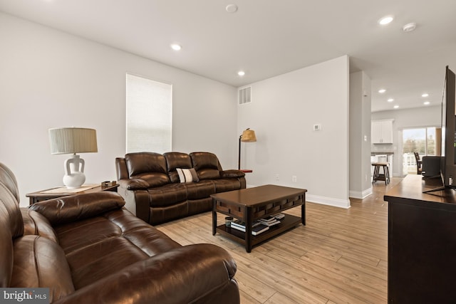 living room with light hardwood / wood-style floors