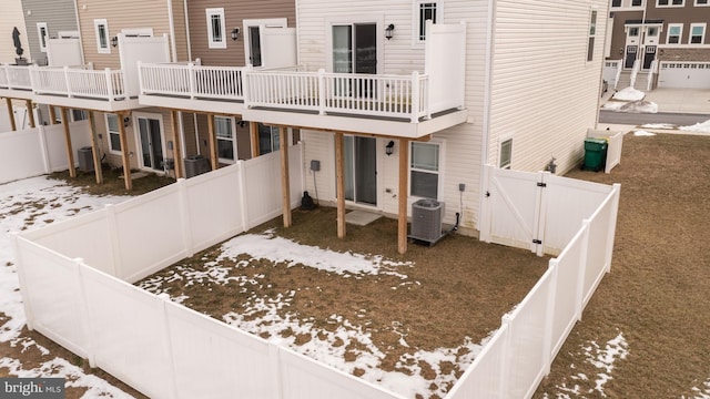 rear view of property with a balcony and cooling unit