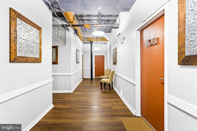 corridor featuring dark wood-type flooring