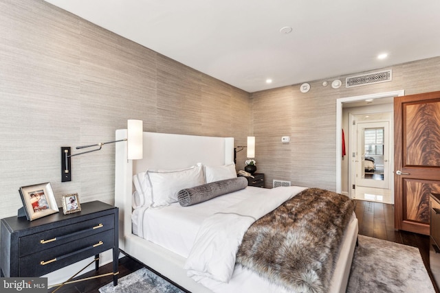 bedroom featuring dark hardwood / wood-style floors