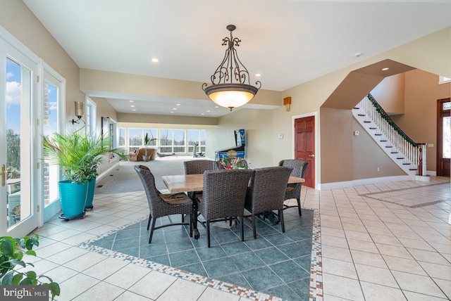 dining room with a wealth of natural light and light tile patterned floors