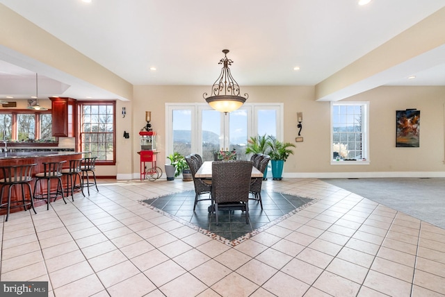 dining room featuring light tile patterned flooring