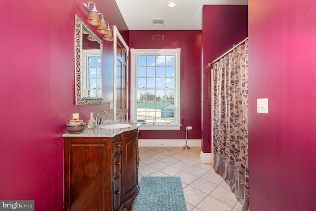 bathroom featuring tile patterned floors and vanity