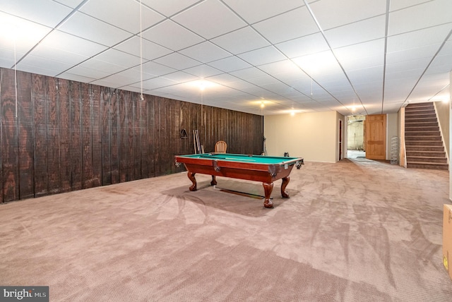 game room with billiards, wooden walls, carpet, and a drop ceiling