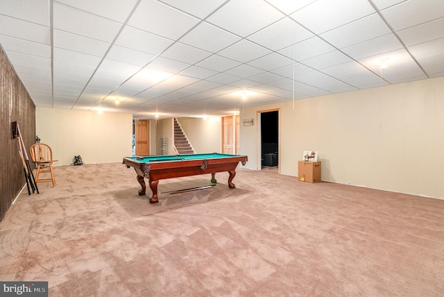 game room featuring light colored carpet, pool table, and a paneled ceiling