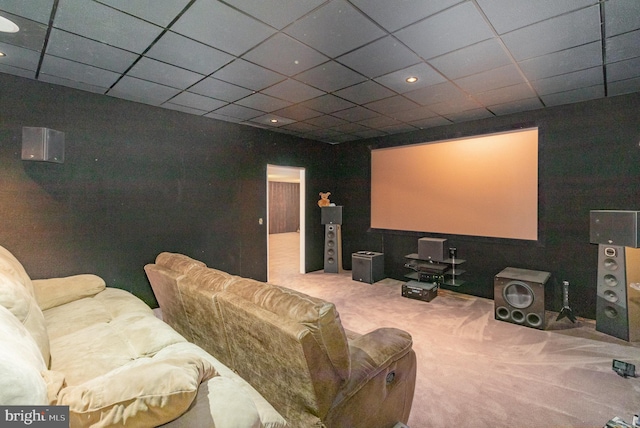 cinema featuring carpet flooring and a paneled ceiling