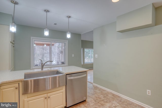 kitchen featuring hanging light fixtures, light tile patterned flooring, sink, and stainless steel dishwasher