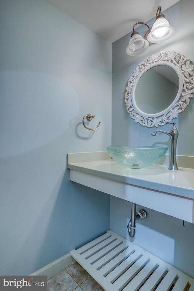 bathroom with tile patterned flooring and sink