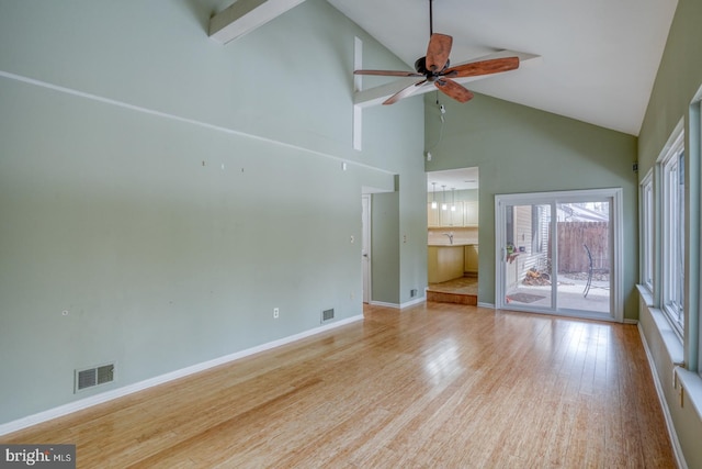 unfurnished living room with ceiling fan, high vaulted ceiling, and light hardwood / wood-style floors