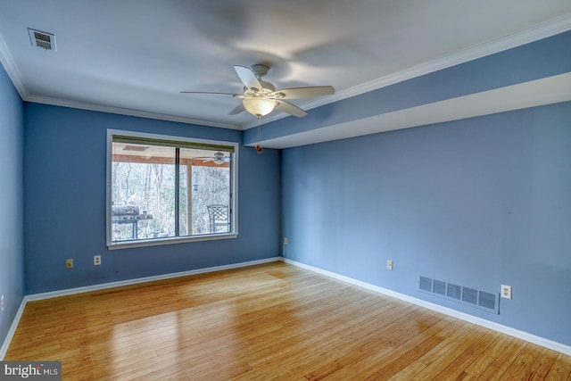 unfurnished room featuring ornamental molding, ceiling fan, and light hardwood / wood-style floors