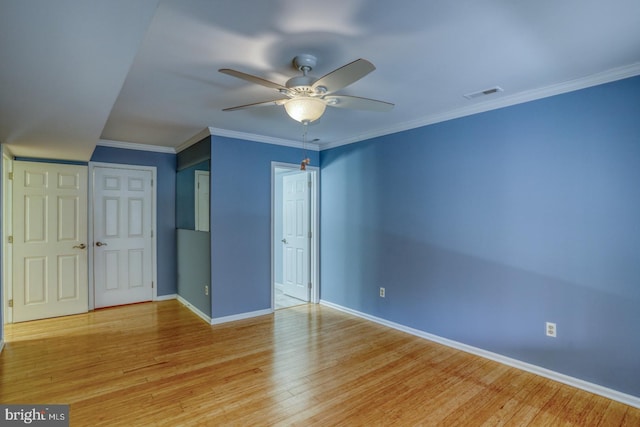 unfurnished bedroom featuring crown molding, light wood-type flooring, and ceiling fan