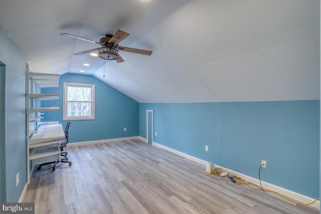 unfurnished office with ceiling fan, lofted ceiling, and light hardwood / wood-style floors