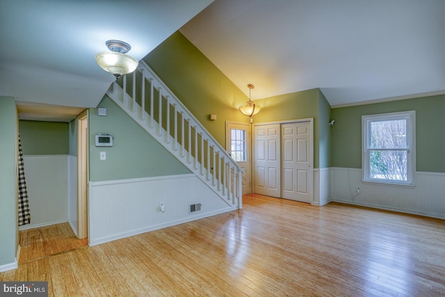 interior space featuring vaulted ceiling and light wood-type flooring