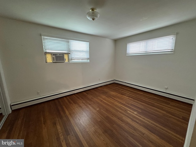 unfurnished room featuring cooling unit and dark wood finished floors