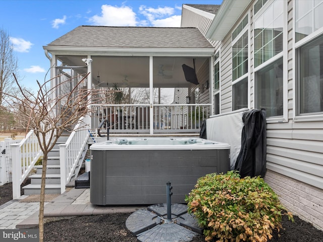 exterior space with a hot tub