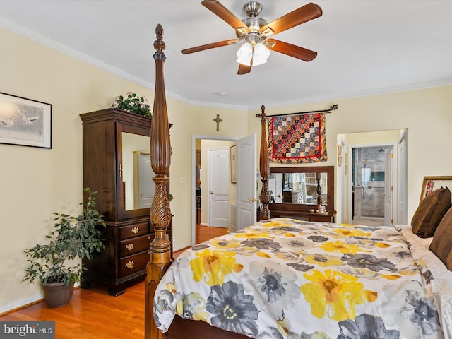 bedroom with crown molding, light hardwood / wood-style flooring, and ceiling fan