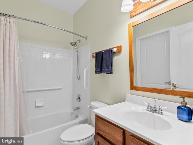 full bathroom with vanity, shower / bath combo, and toilet