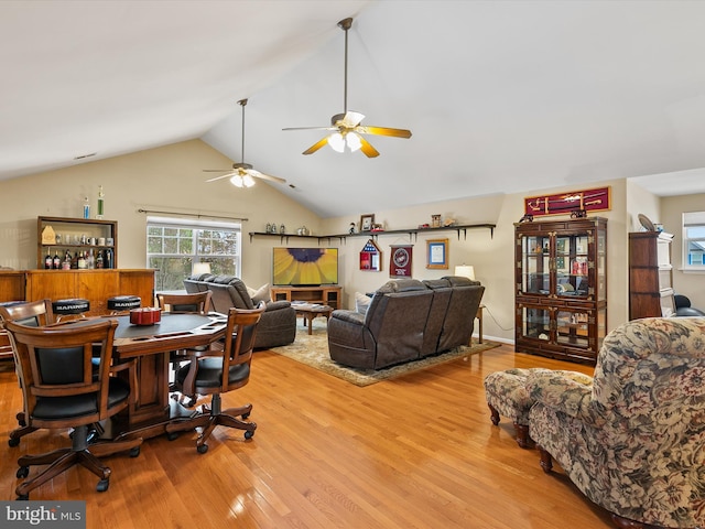 office space with lofted ceiling and light hardwood / wood-style flooring