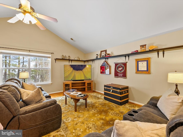 living room featuring vaulted ceiling and ceiling fan