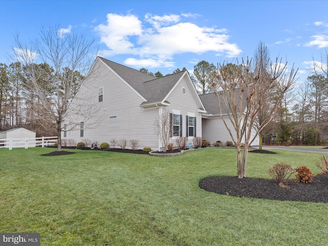 view of home's exterior featuring a lawn