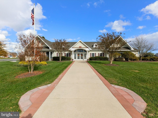 view of front of house featuring french doors and a front lawn