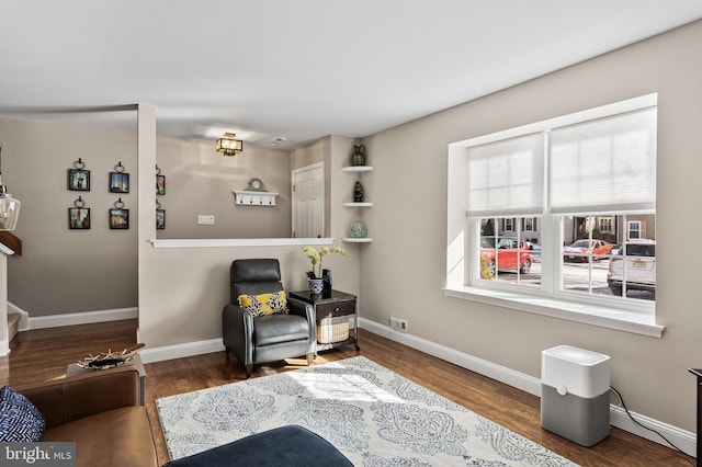 living area with dark hardwood / wood-style floors