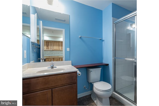 bathroom featuring tasteful backsplash, tile patterned flooring, a shower with door, and toilet