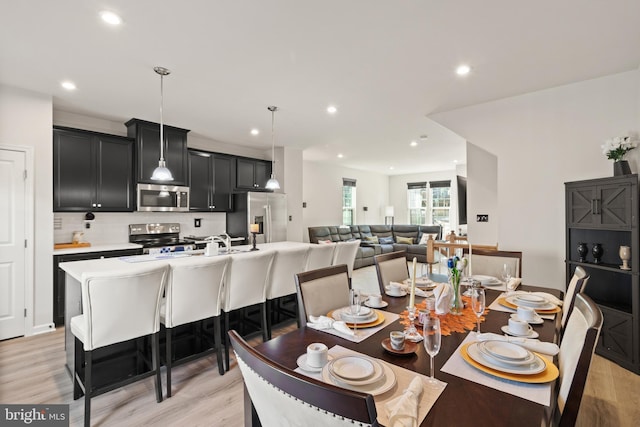 dining area with light hardwood / wood-style flooring