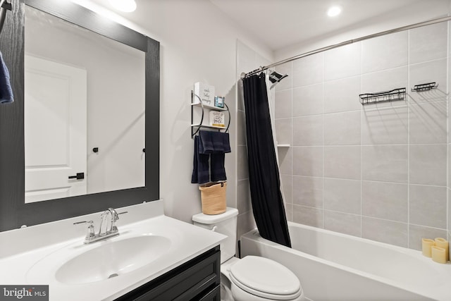 full bathroom featuring toilet, vanity, and shower / bath combo with shower curtain