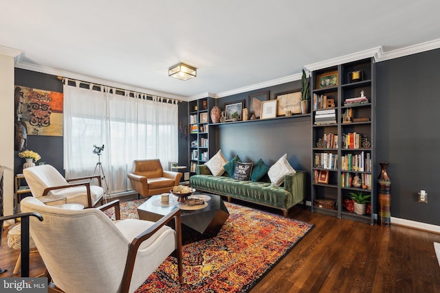 sitting room with dark wood-type flooring and ornamental molding