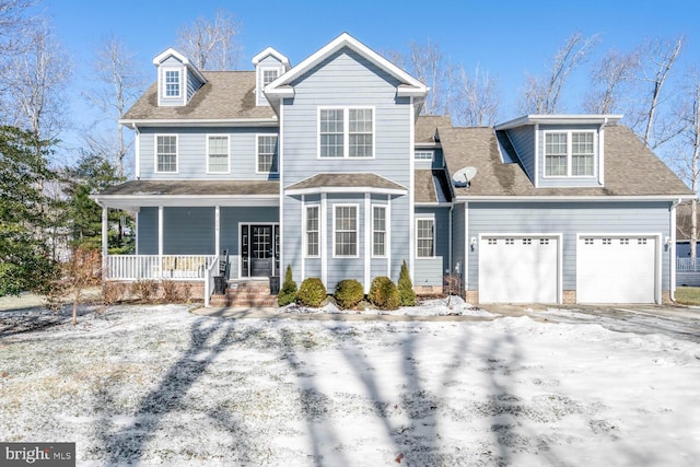 view of front of home with a garage and covered porch