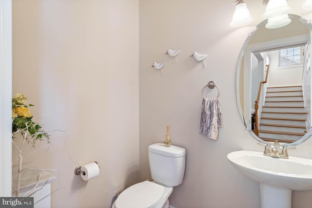 bathroom featuring sink and toilet