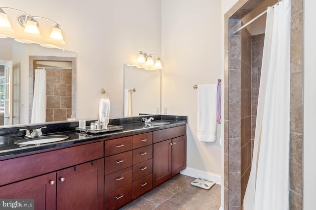 bathroom featuring vanity, tile patterned floors, and walk in shower