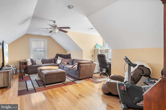 interior space featuring ceiling fan, lofted ceiling, and light hardwood / wood-style floors