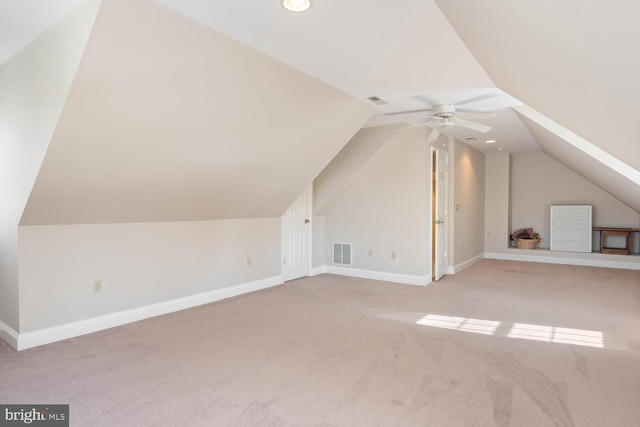 bonus room with lofted ceiling, light colored carpet, and ceiling fan