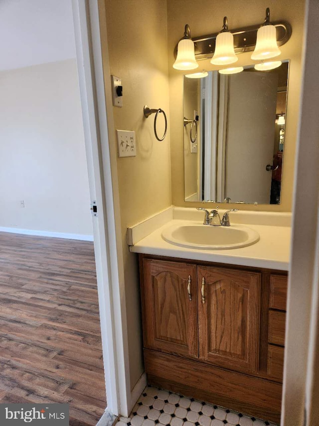 bathroom featuring hardwood / wood-style floors and vanity