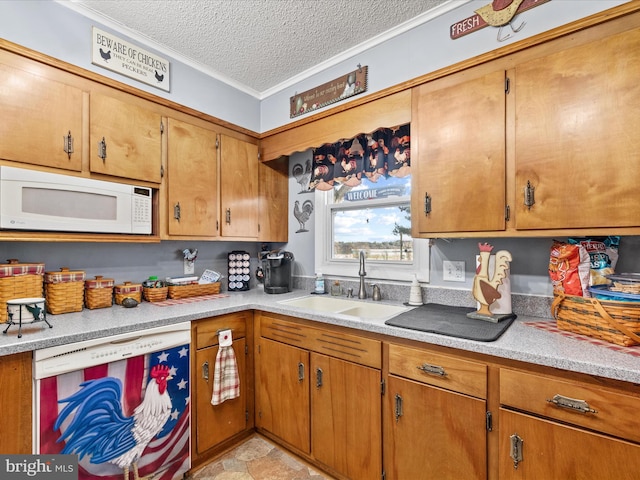 kitchen featuring sink, white appliances, and a textured ceiling