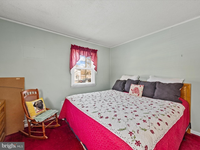 bedroom with a textured ceiling and carpet flooring