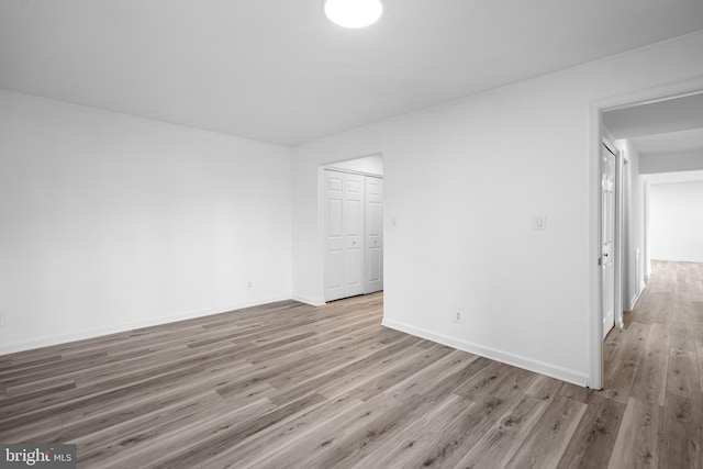 empty room with light hardwood / wood-style floors