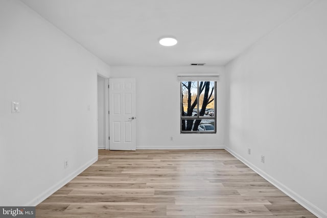 unfurnished room with light hardwood / wood-style flooring