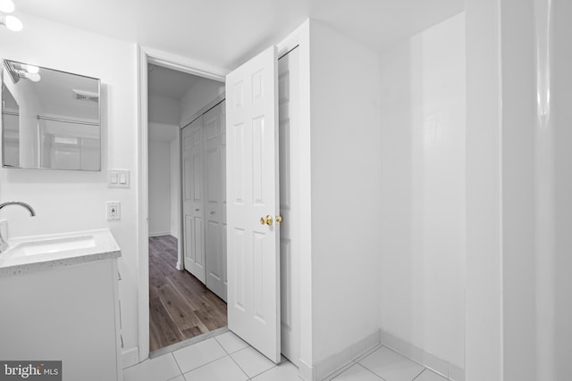 bathroom with vanity and tile patterned flooring